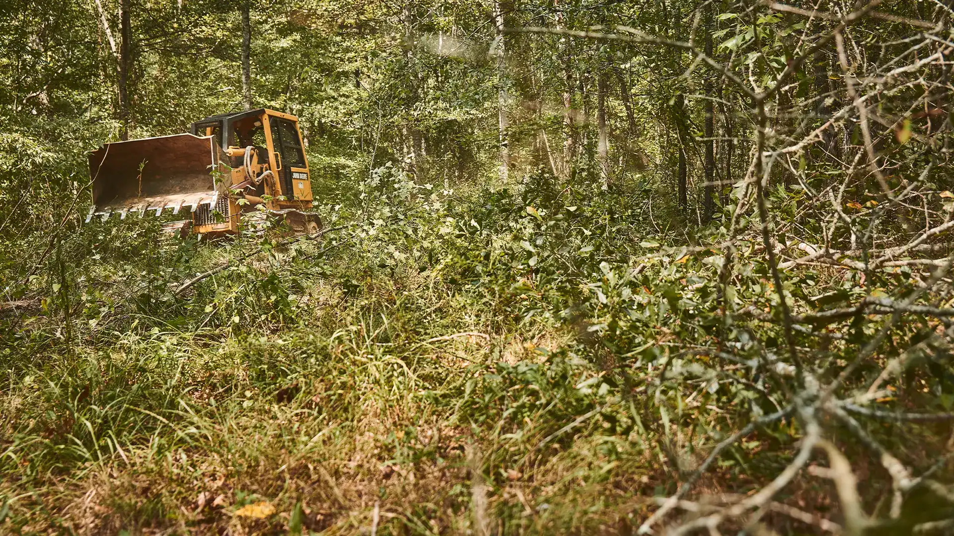 Photo of Ryan Dempsey and Austin Taylor with an excavator